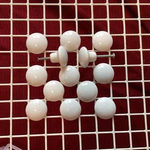 12 white ceramic knobs
